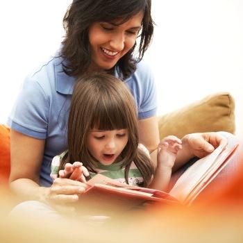 adult and child reading a book