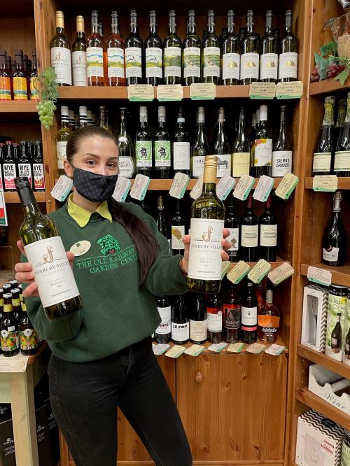 Beth Howell, Farm Shop Assistant at The Old Railway Line Garden Centre, with wines from Foxbury Fields Vineyard