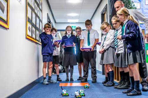 children from Silverstone primary school during the first Full STEAM Ahead! coding club sessions, plus an example of their creations.