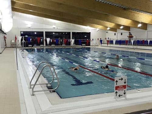 Swimmers take the plunge shortly after the new pool opened at 7am on Monday, 12 November 2018.   