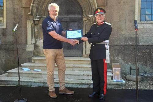  'Brewery director, John Evans, received the award from HM Lord Lieutenant of Northamptonshire, James Saunders Watson'
