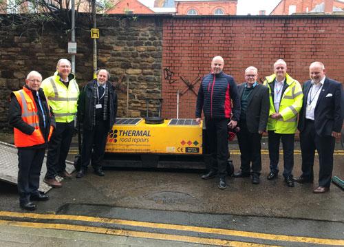 thermal pothole repair machine alongside Northamptonshire County Council Leader Matt Golby and other Northamptonshire council leaders.