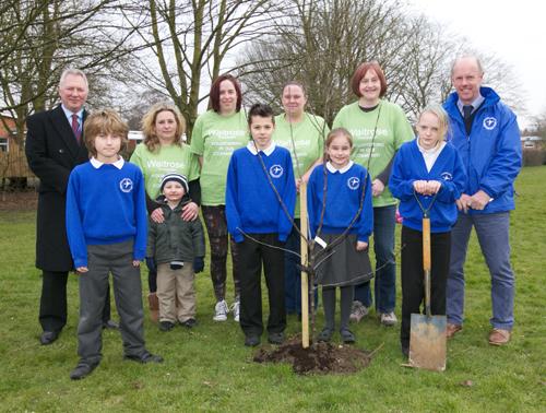 Left Mike Stephenson manager of Waitrose in Towcester and right Mr Camp, headteacher of Towcester C of E Primary School with partners of Waitrose and school children