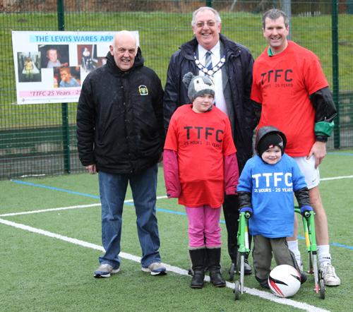Brian Taylor, chairman of South Northants Leisure Trust, the Mayor of Towcester Councillor David Linney, Tony Pickworth and Lewis Wares in the rain at the start of the Football Festival