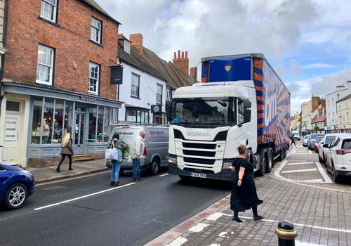 Local Liberal Democrats are sceptical of reports that an environmental weight restriction and traffic calming measures have been agreed by National Highways for Towcester’s town centre. 