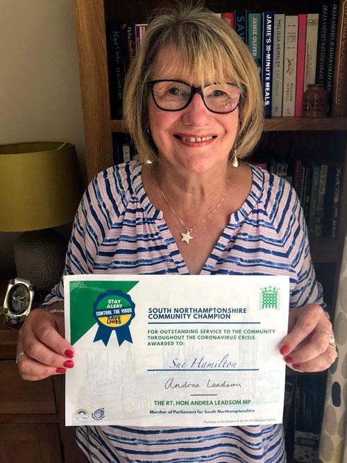 President of Towcester Evening WI, Sue Hamilton, is very proud to receive a Community Champion Certificate from our local MP, Andrea Leadsom.