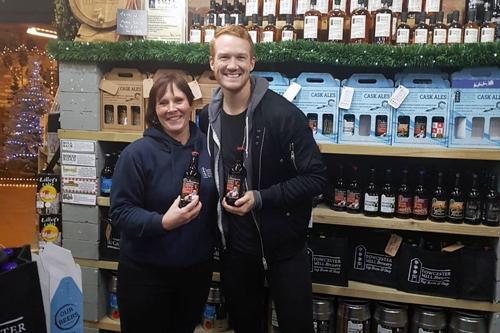  famous face popped into Towcester Mill Brewery's Shop last month, pictured here with shop manager, Caroline Hares  