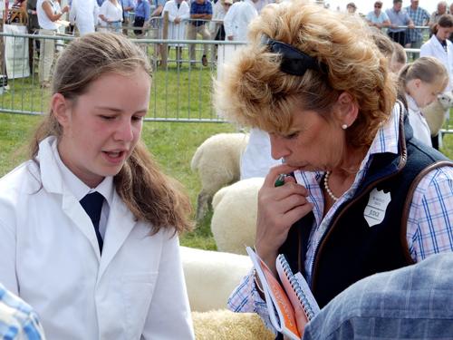 Barbara Smith from Slapton; a judge in the Young Shepherd Class; speaks to one of the competitors.