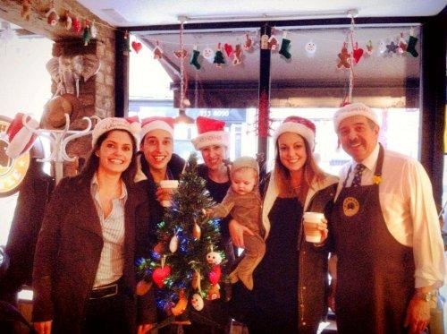 Juice FM presenters switch on the Christmas tree lights at Elephant Coffee
