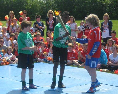 Woodfall hand over the torch for the next leg of the relay