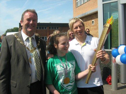 The Mayor of Neston and Craig Heap with torch carrier Megan