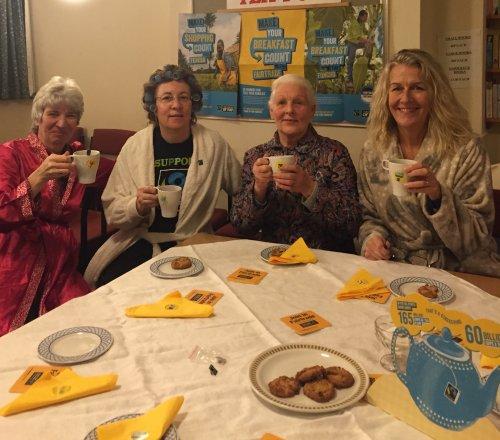 Dressing gowns on for Fairtrade breakfast launch in Neston