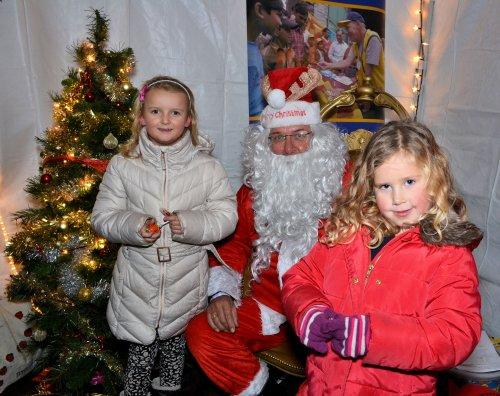 Neston Rotary Club's Father Christmas meets local children at the Lights 'n' Lanterns event